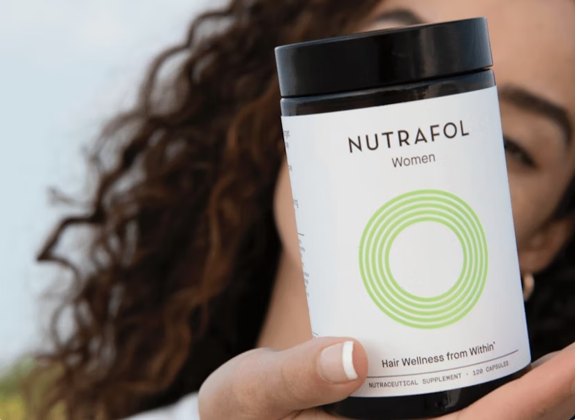 Woman holding Nutrafol